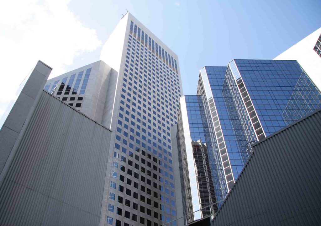 Glass residential towers in downtown Calgary seen from street level