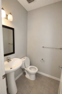 Brightened bathroom with clean surfaces 15