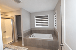 Clean naturally lit rental bathroom 5