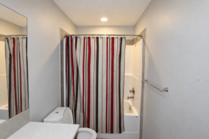Naturally lit empty rental bathroom 17